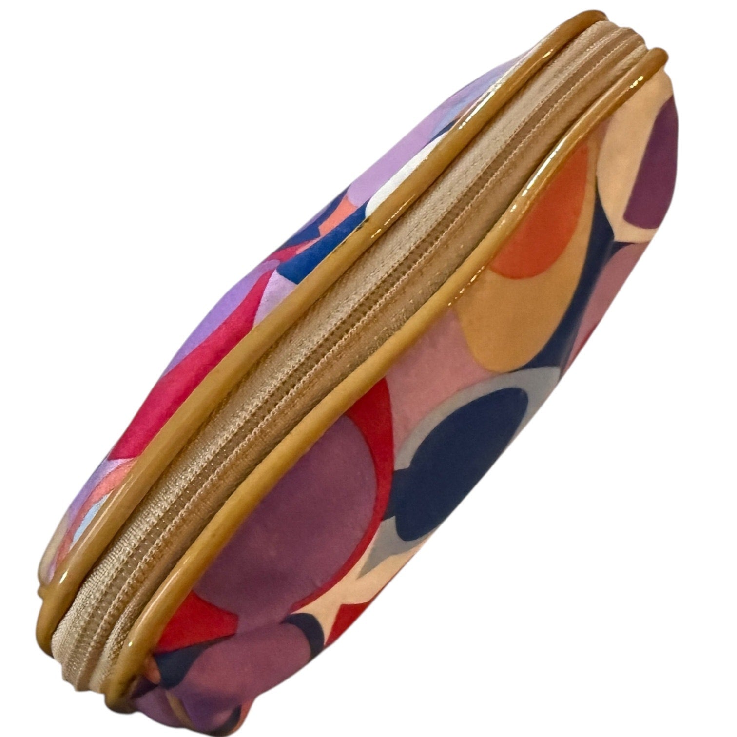 Top of Colorful pouch with a gold zipper on a white background