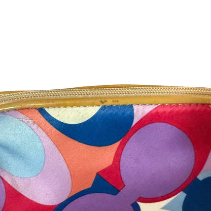 Showing issues on Colorful CC patterned pouch with a gold zipper on a white background