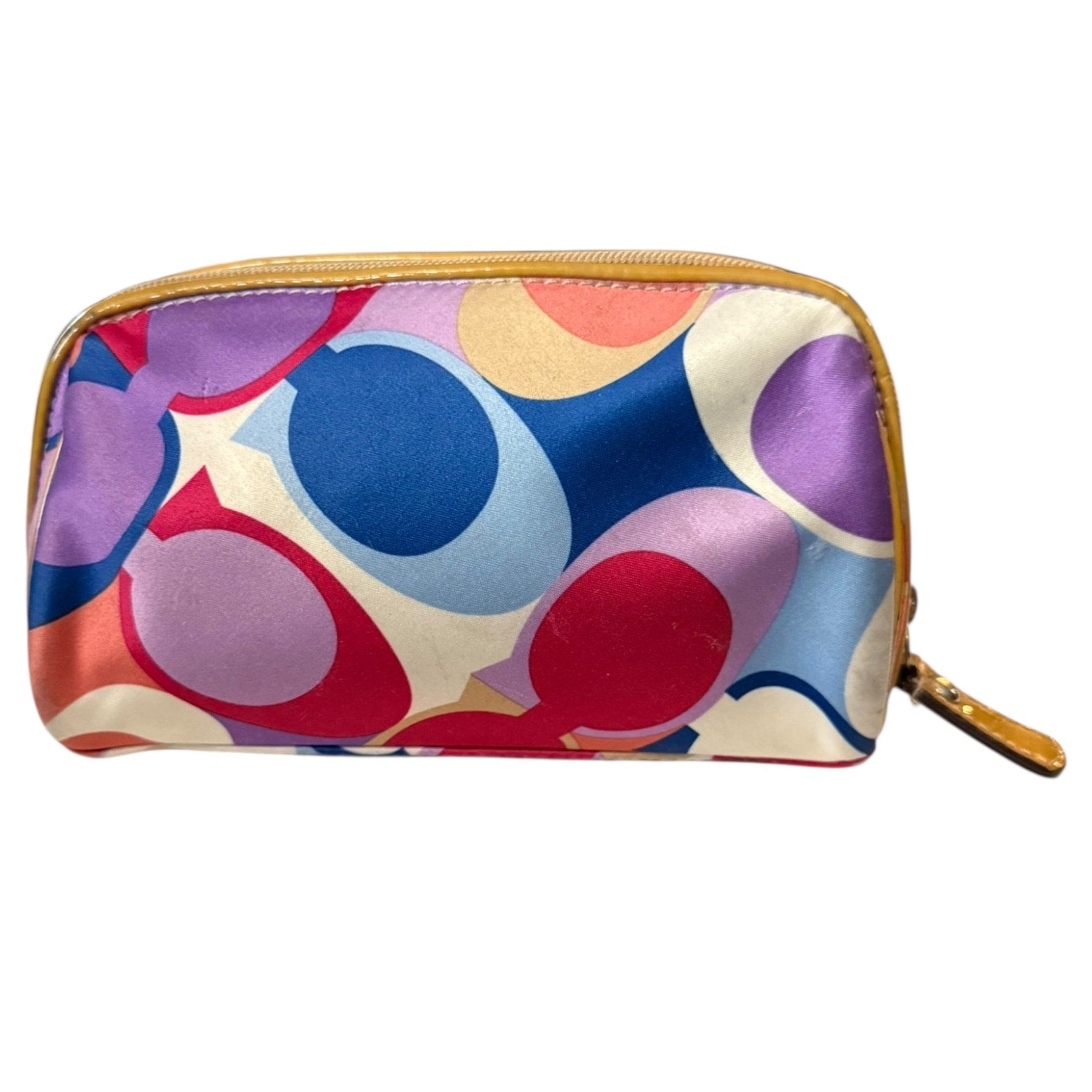 Front of Colorful circular patterned pouch with gold zipper on a white background
