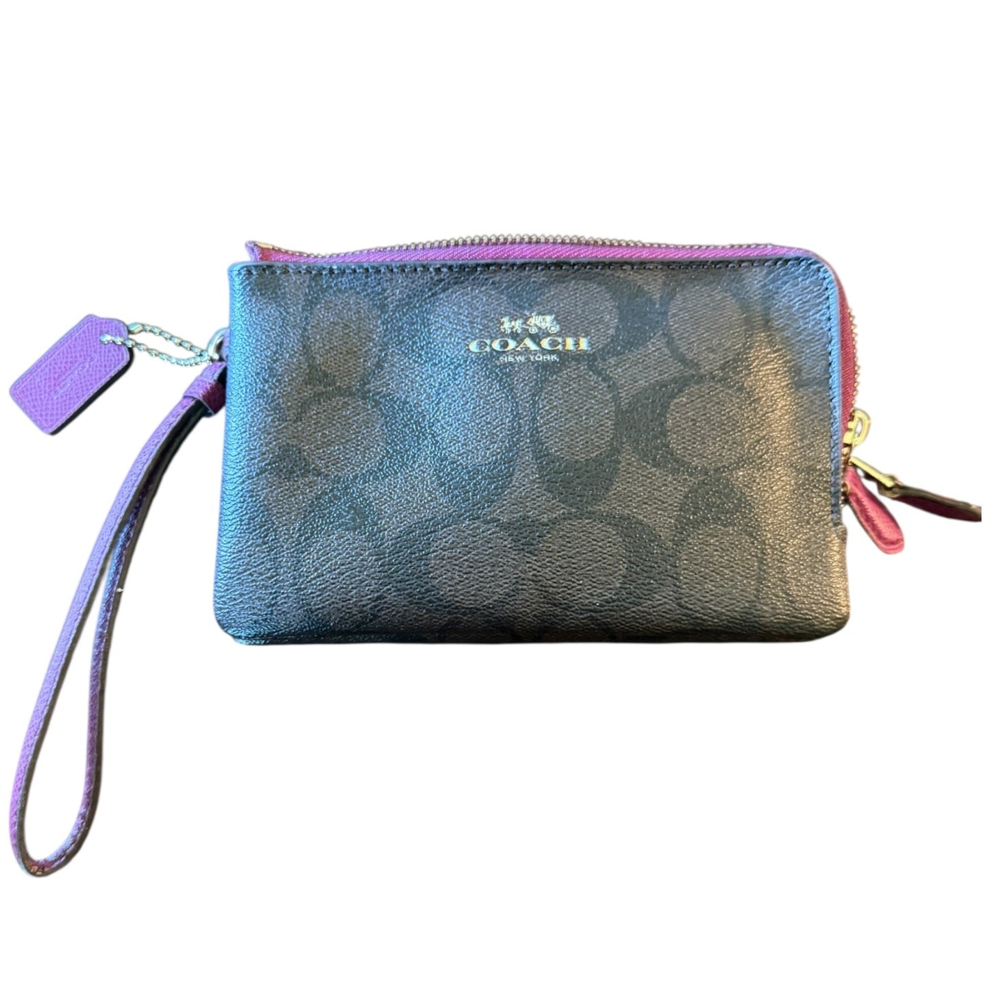 Coach wristlet with CC logo and tag on a white background