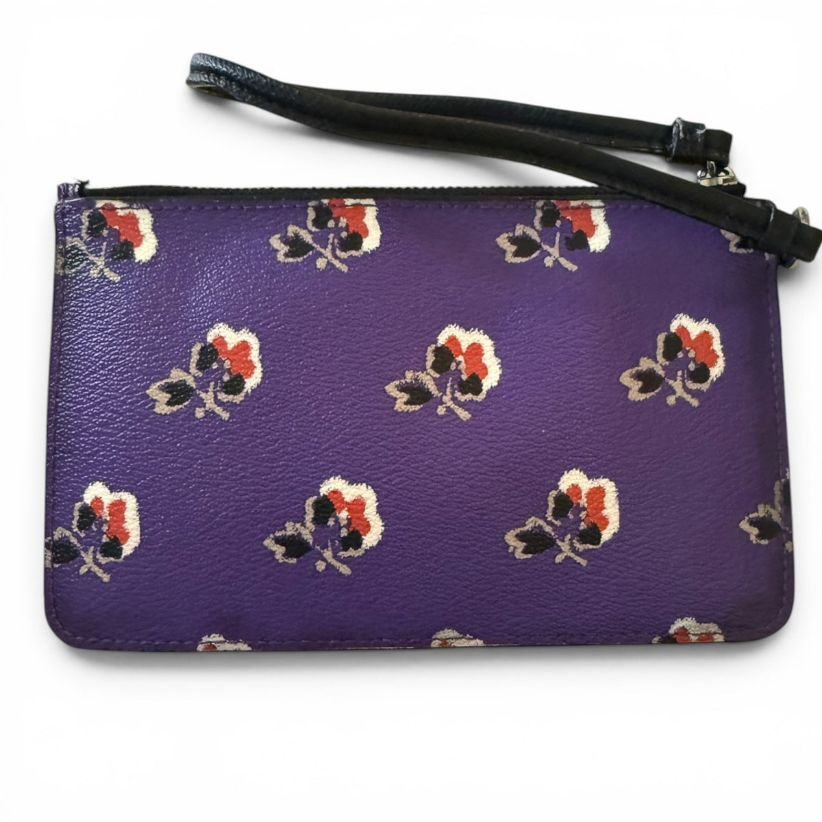 Purple wristlet with floral pattern on a white background