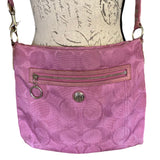 Purple CC textured handbag with a zipper on a white background