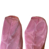 Corners of purple purse on a white background