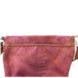 purple purse with purple strap on a white background
