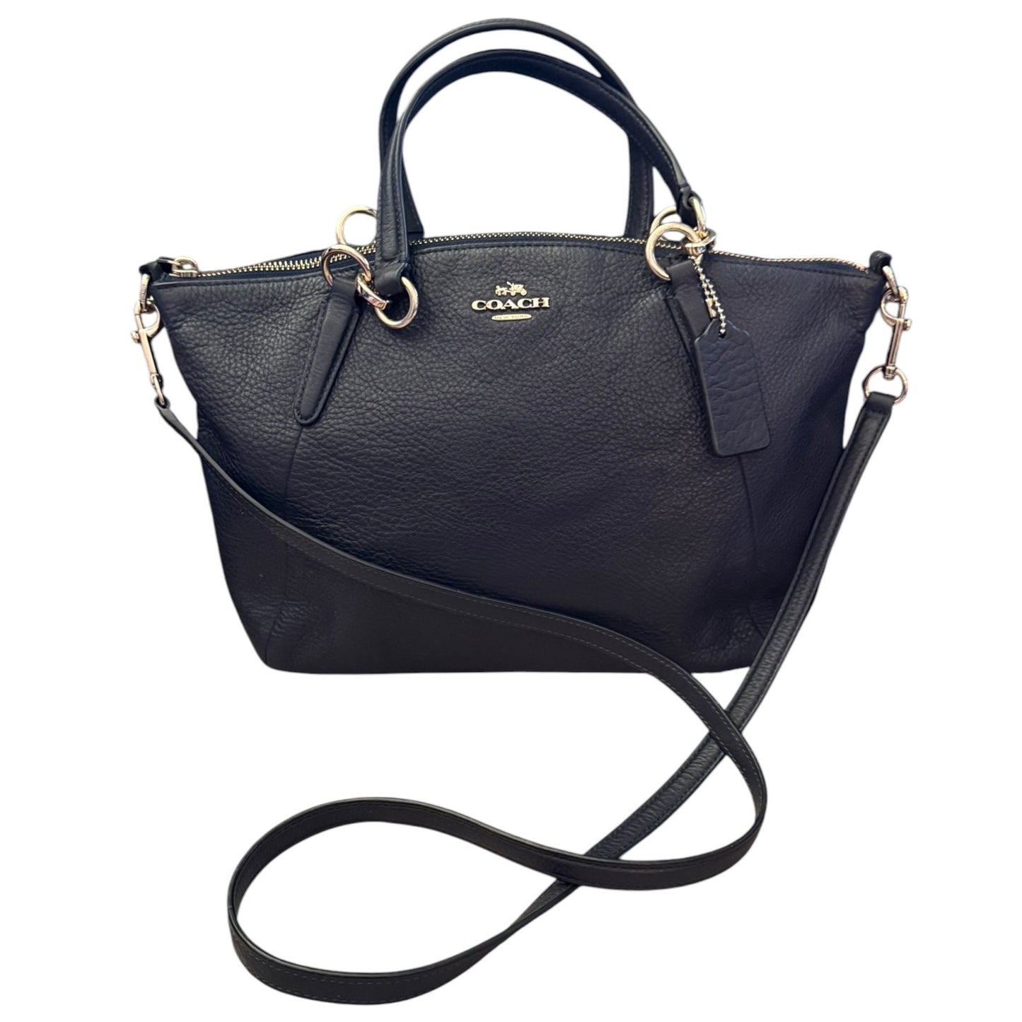 A black pebbled leather Coach handbag , featuring dual top handles, a shoulder strap, and a visible Coach logo on the front.