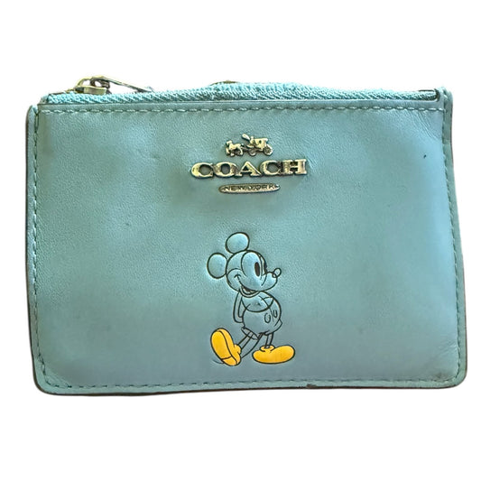 Light blue Coach wallet with cartoon character on a white background