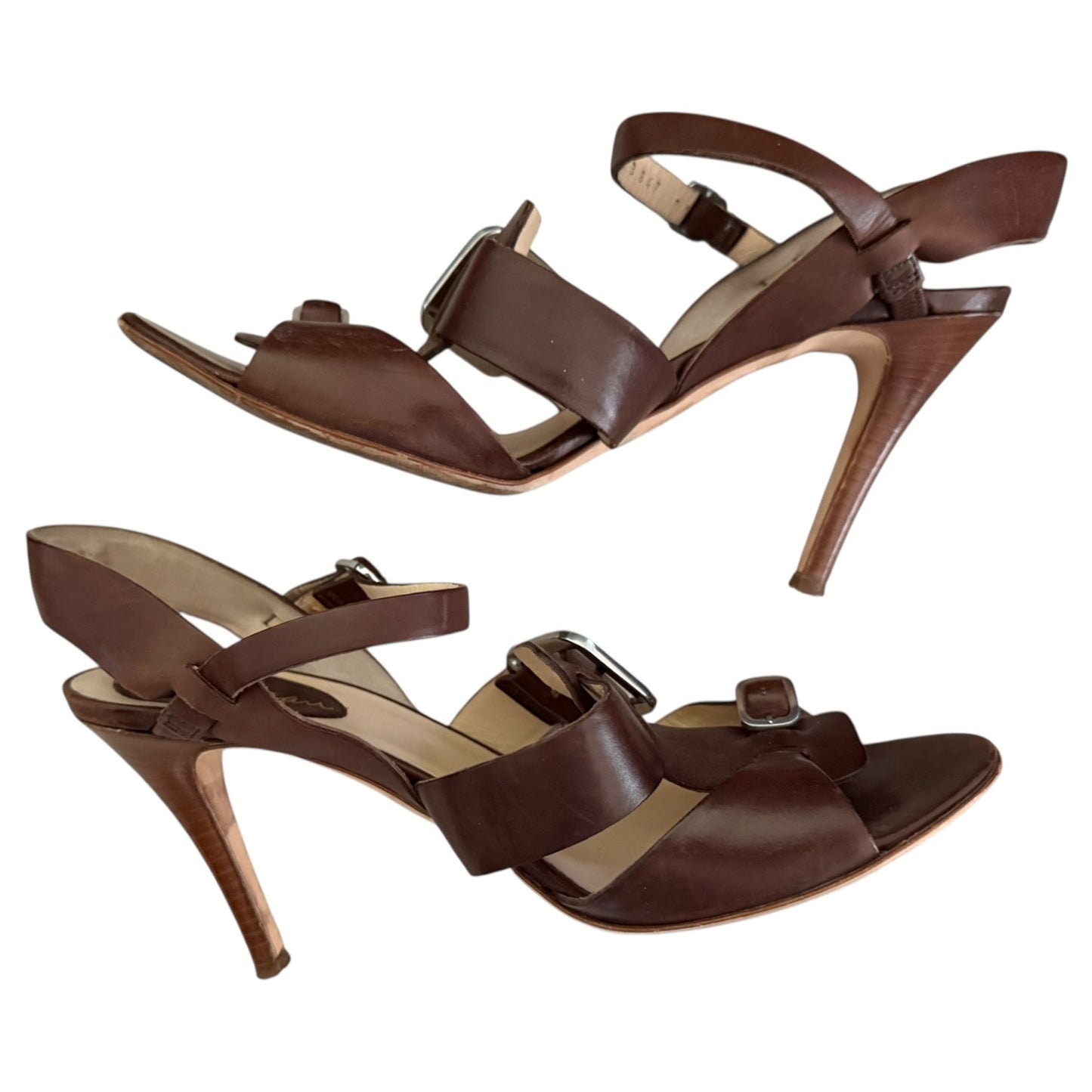 Side view 2 Pair of brown high-heeled sandals on a white background