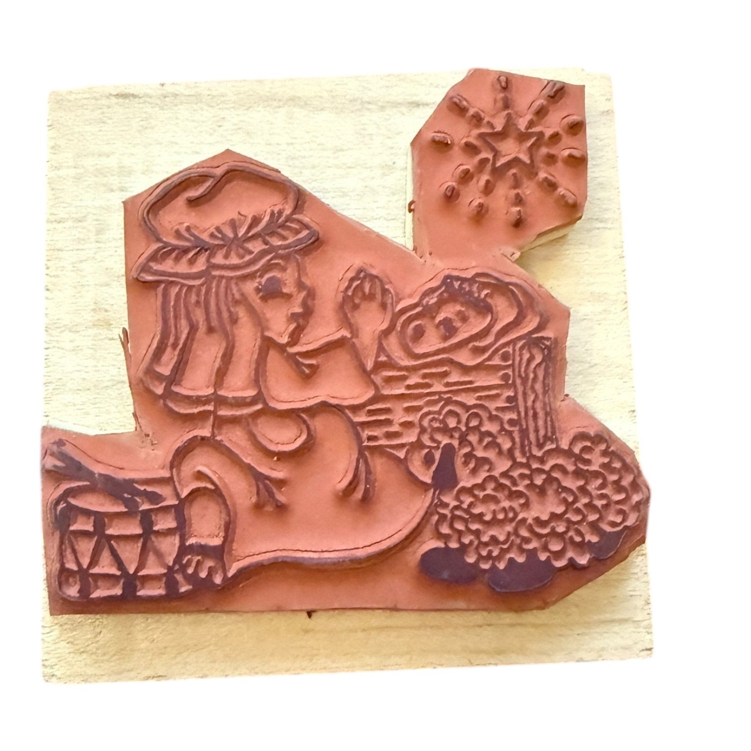 Decorative rubber stamp on a light wood background