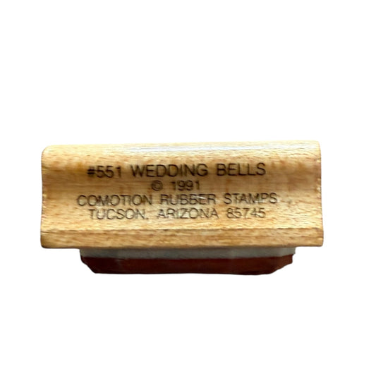 Wooden stamp with 'Wedding Bells' text on a white background