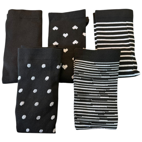 Set of black and white patterned socks on a white background