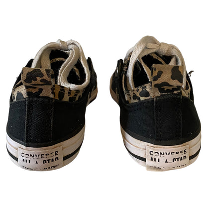 Black Converse sneakers with animal pattern on a white background