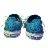 Back of Blue sneakers with 'All Star' branding on a white background