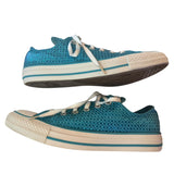 Side of a Blue and white sneakers with a geometric pattern on a white background