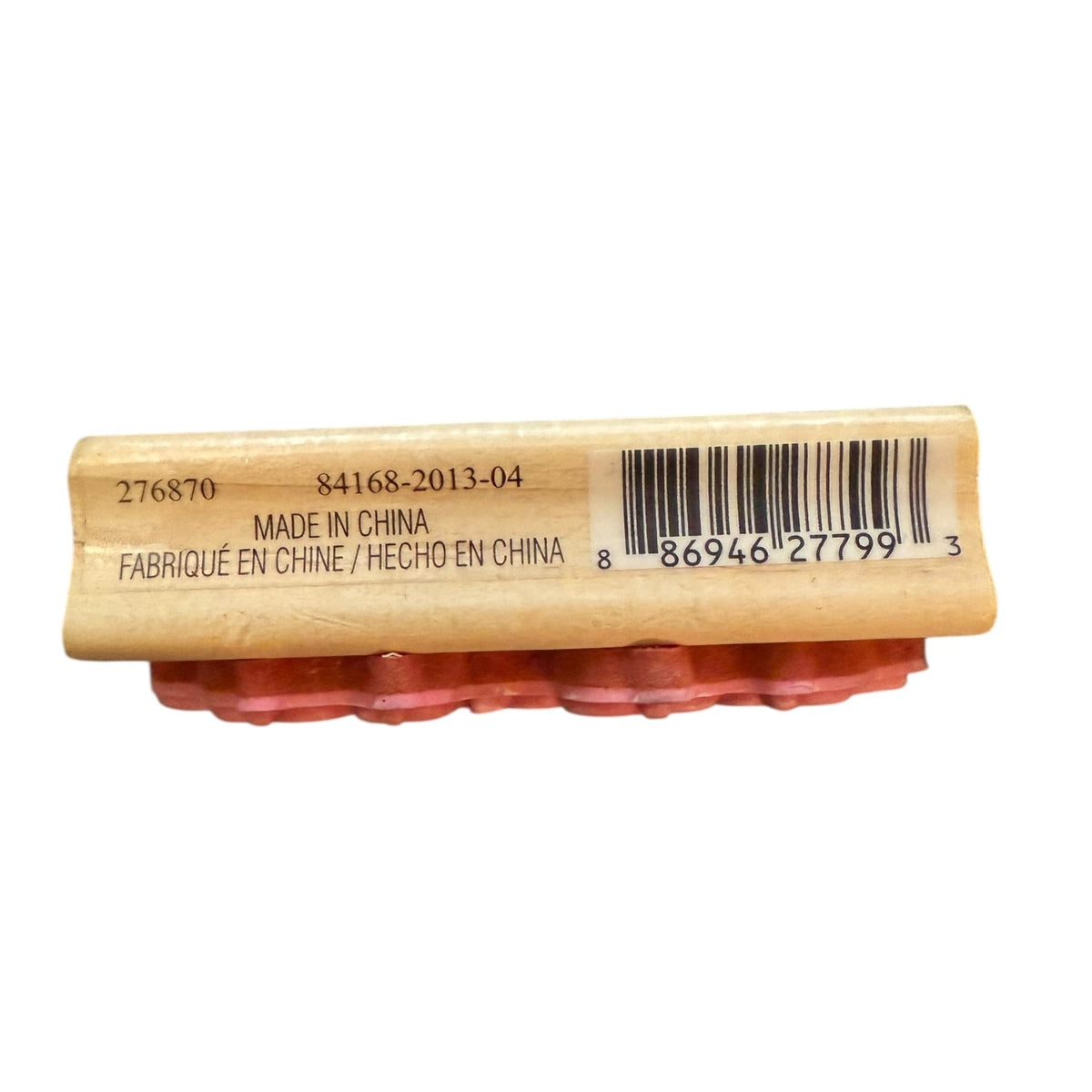 Side of a wood block stamp and a barcode label on a white background