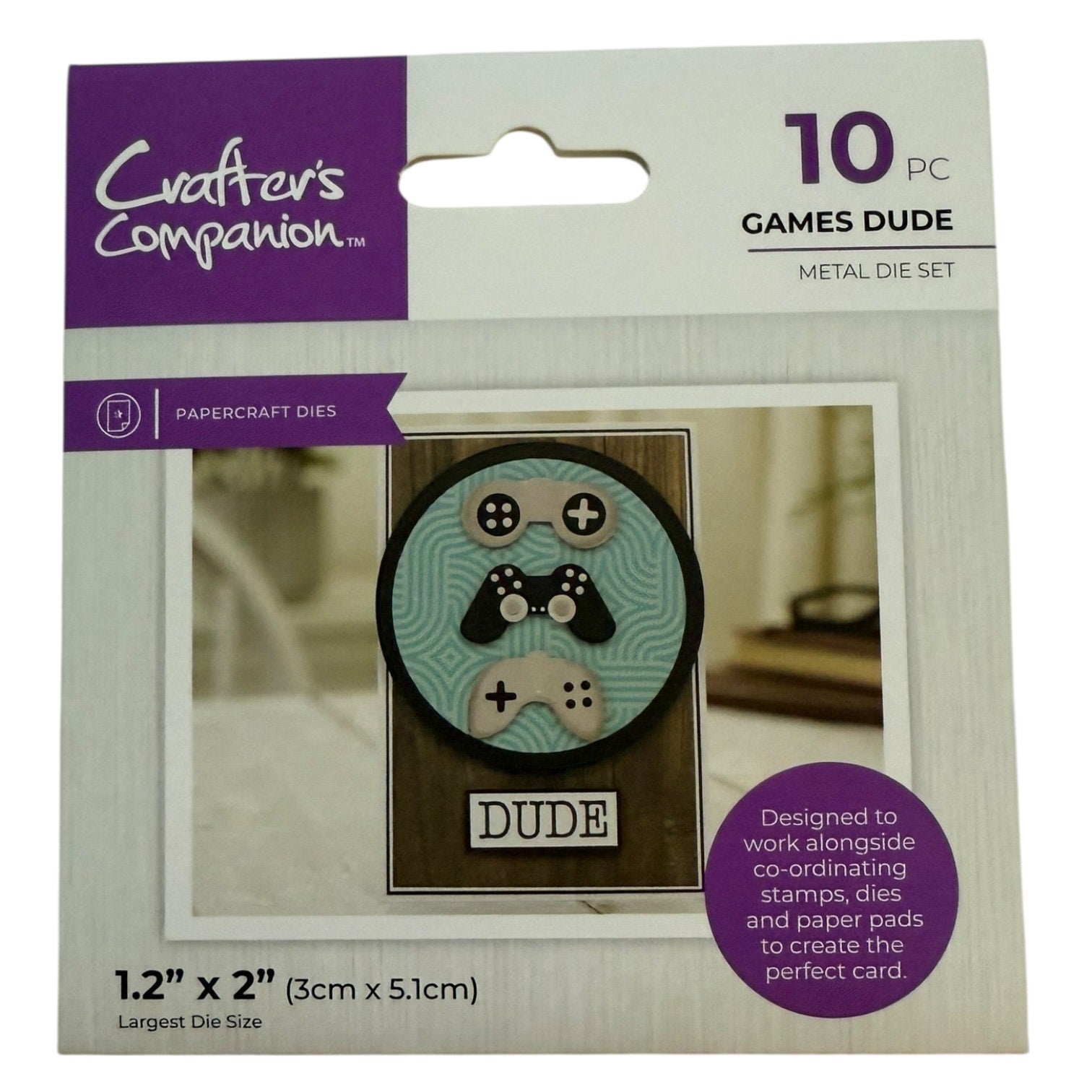 Packaging of Crafter's Companion Games Dude metal die set with die sample and product details.