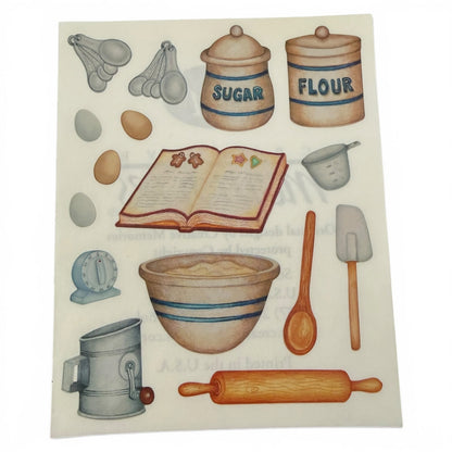 Illustrated stickers of kitchen items including a bowl, rolling pin, and measuring cups on a white background