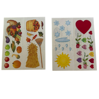 Two sheets of colorful autumn, love and winter-themed stickers on a plain white background. 