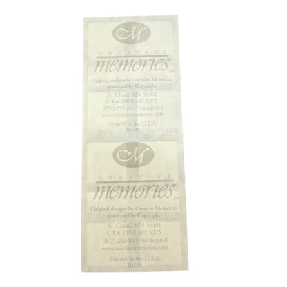 White sticker sheet back printed with the logo and name 'Creative Memories' along with contact information.