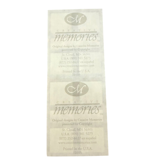 White sticker sheet back printed with the logo and name 'Creative Memories' along with contact information.