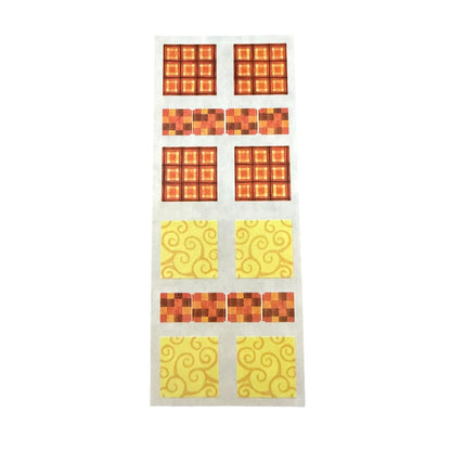 Yellow and orange square stickers on a white sheet on a white background