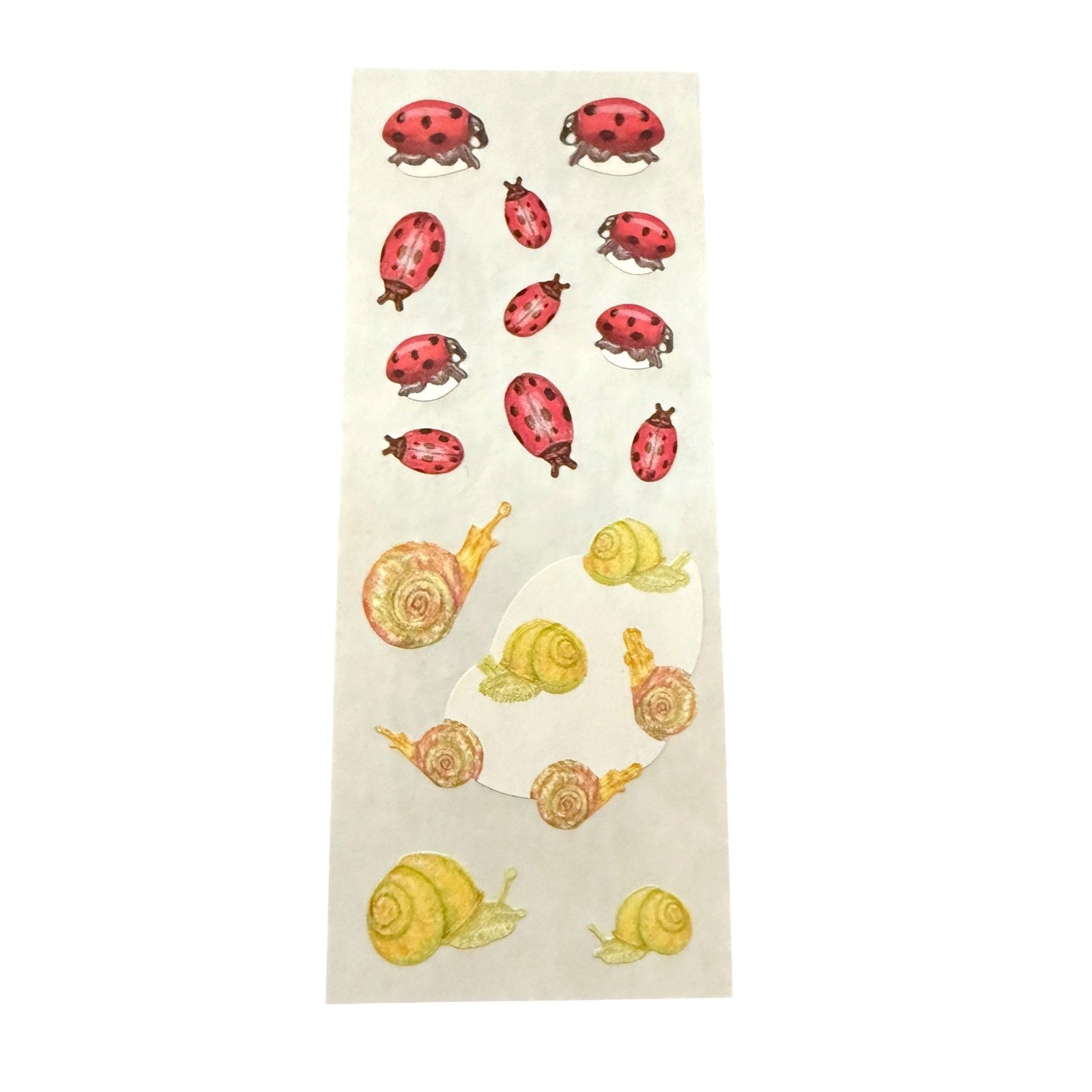 A sheet of decorative stickers featuring watercolor-style ladybugs in red and snails in yellow and beige, on a white background.