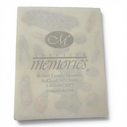Sheet of 'Creative Memories' stickers with branding and contact information.