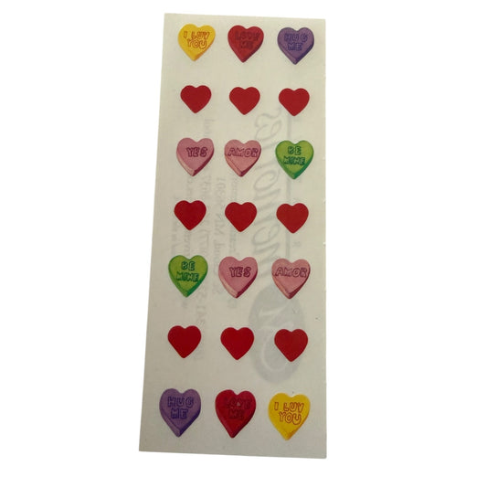 Sheet of colorful heart-shaped stickers on a white background