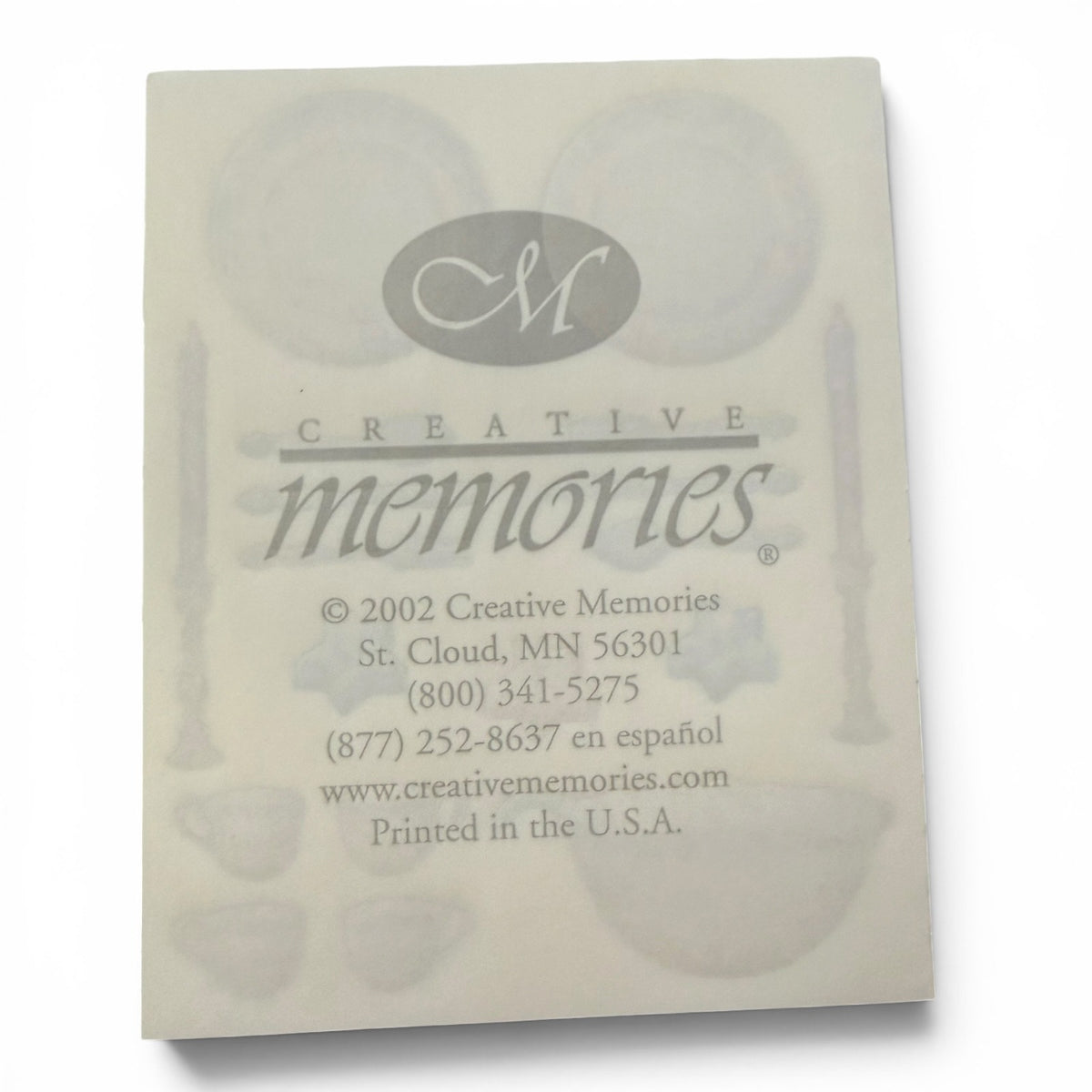 Back of a product packaging with 'Creative Memories' branding and contact information.
