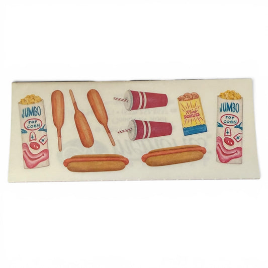Stickers of hot dogs, corn on the cob, and drinks on a white background