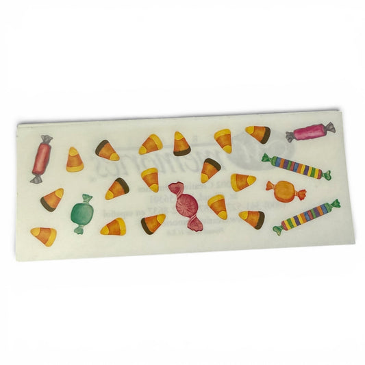 Sheet of stickers with colorful candy-themed design on a white background