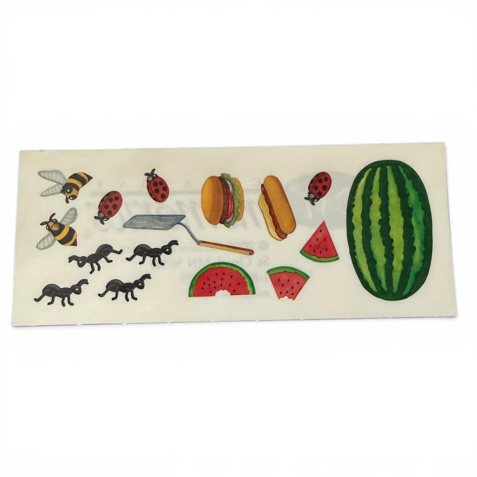 Sheet of stickers with various designs including watermelons, hamburgers, and insects on a white background.