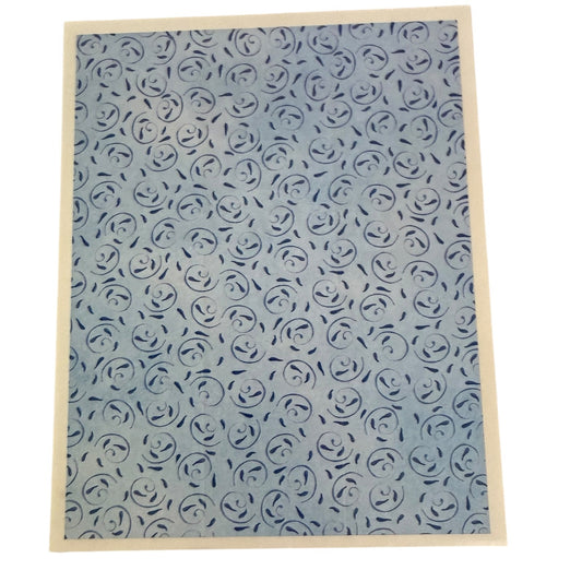 Patterned sticker with blue rose design on a white background