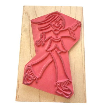 Red rubber stamp of a person on a wooden block