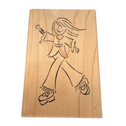 Wooden block with a black line drawing of a person on a white background