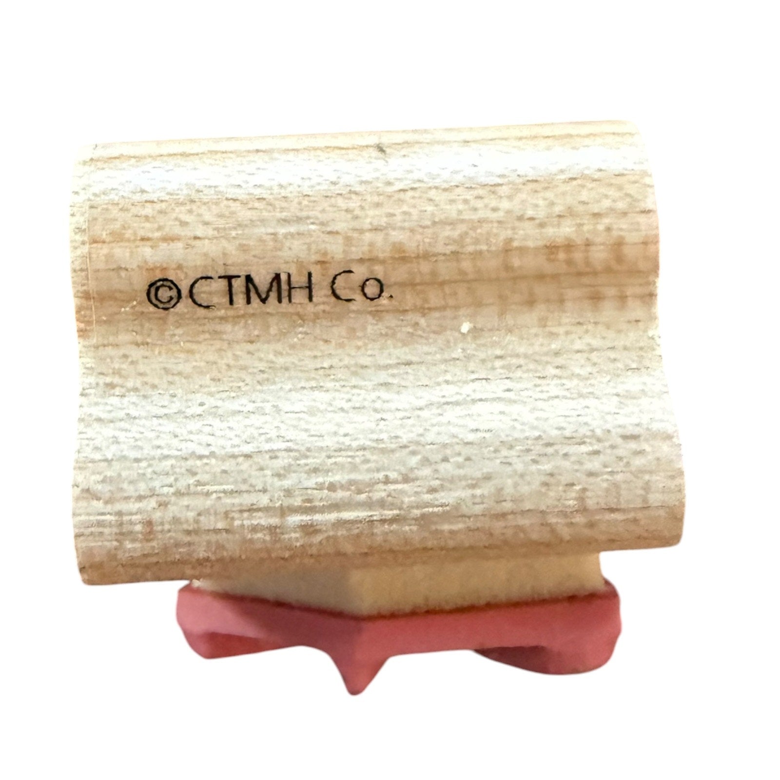 A wooden rubber stamp block featuring the copyright text '©CTMH Co.' printed on the wood, shown against a plain white background.