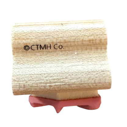 A wooden rubber stamp block featuring the copyright text '©CTMH Co.' printed on the wood, shown against a plain white background.