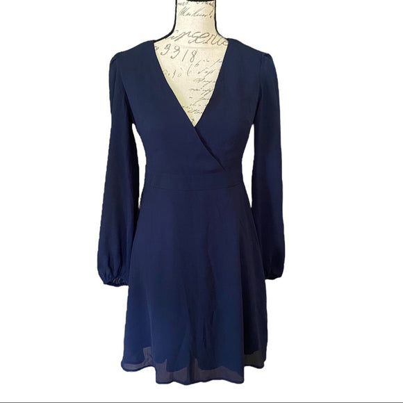 Front of Navy blue dress on a mannequin against a white background