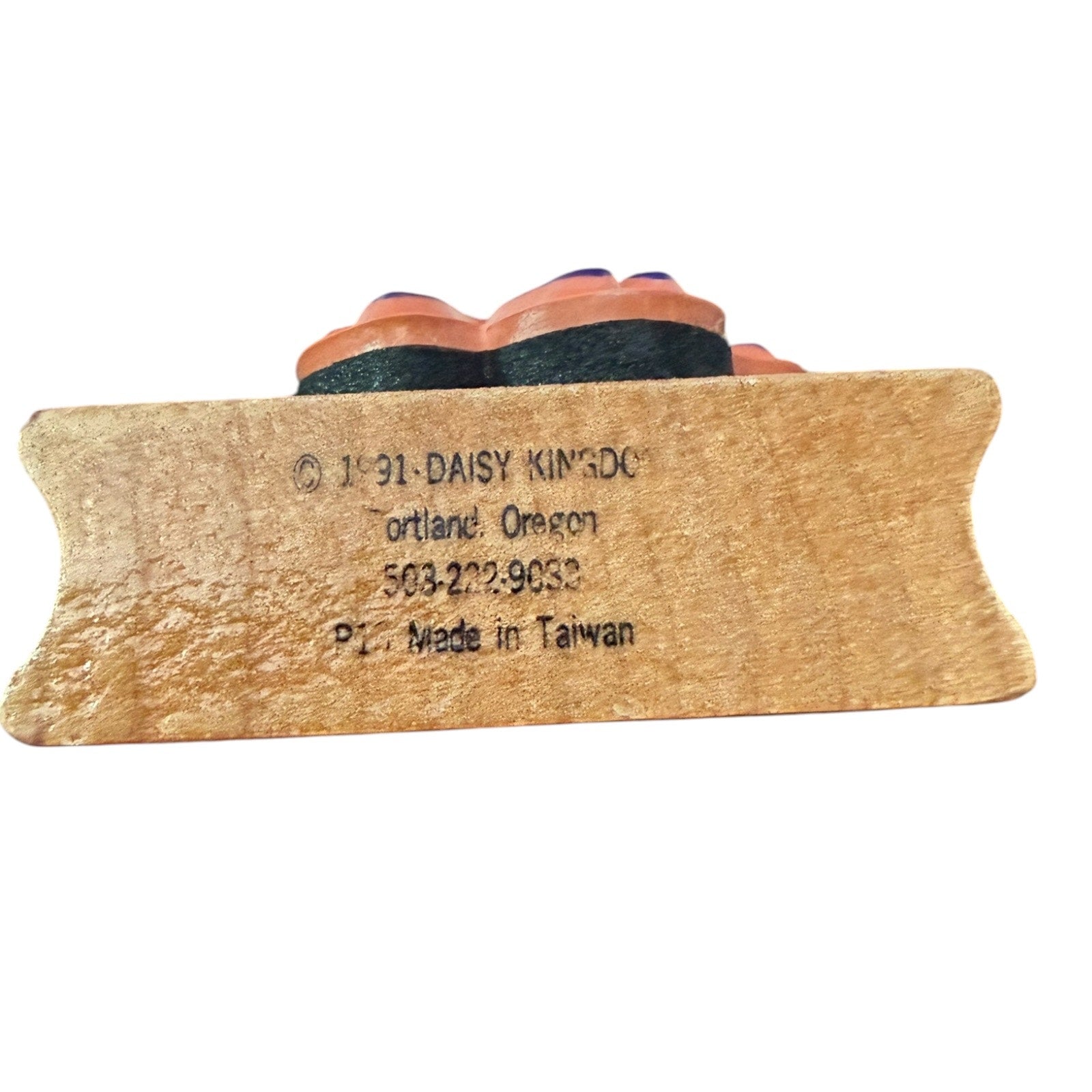 Wooden product with branding and contact information on a white background