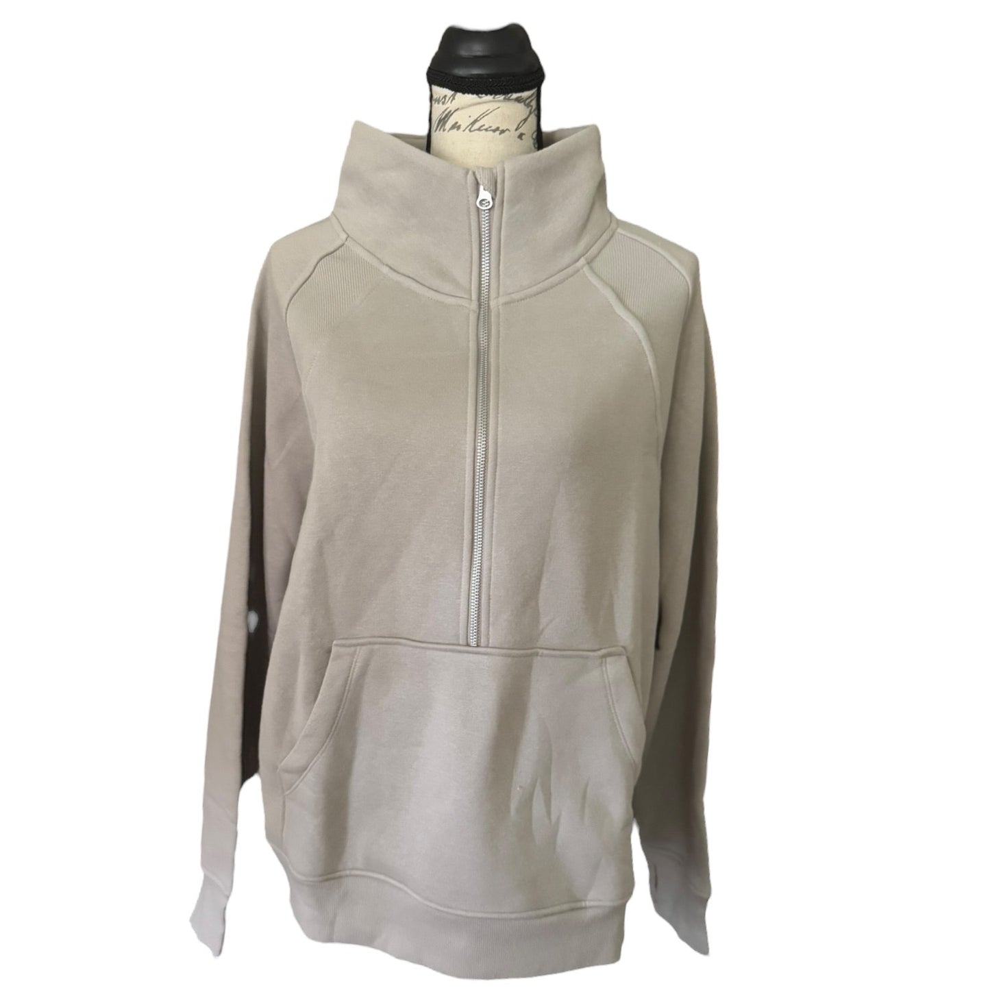 Beige pullover with a zipper on a white background