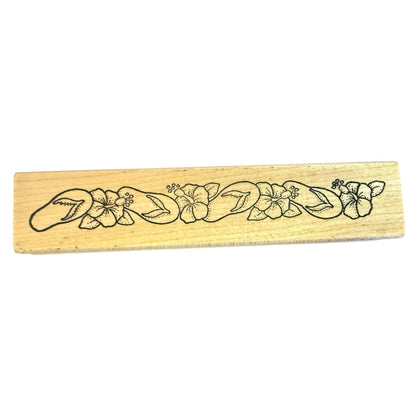 Wooden stamp with floral design on a white background