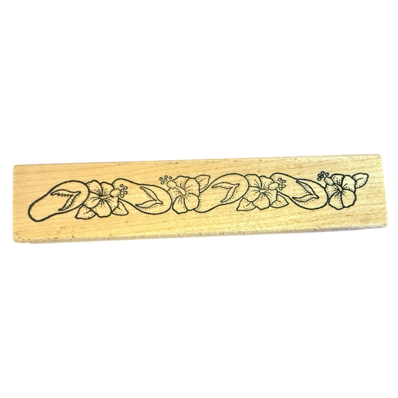 Wooden stamp with floral design on a white background