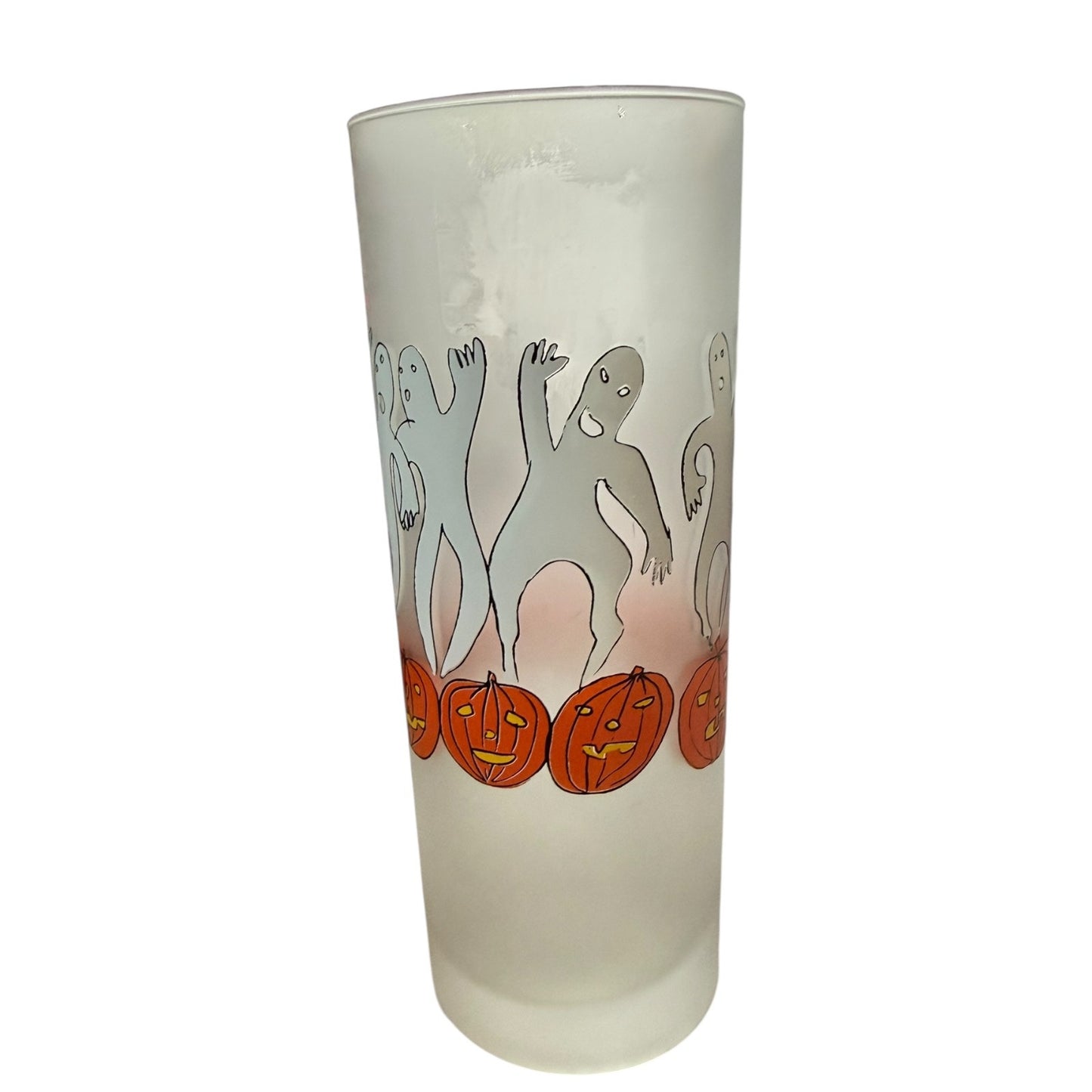 Frosted glass tumbler with Halloween-themed design of ghosts and pumpkins on a white background