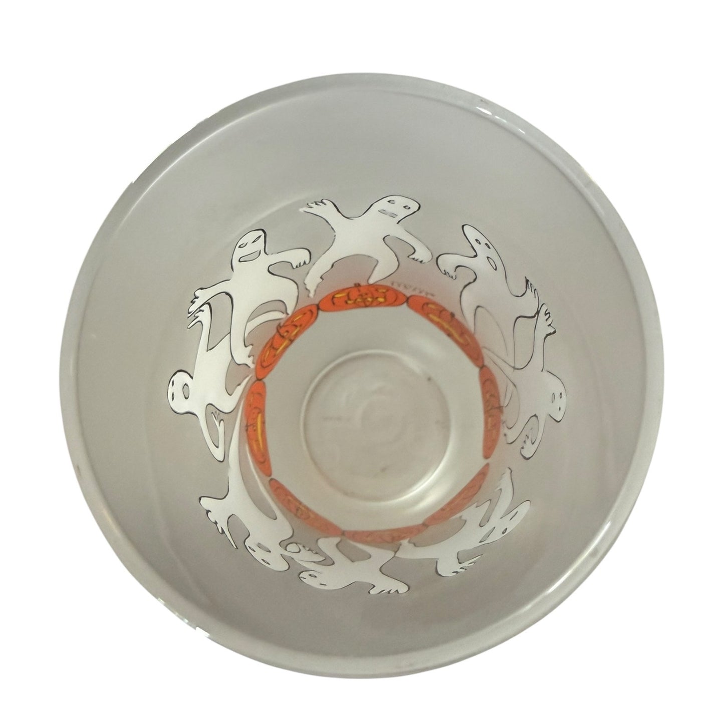 Clear glass glass tumbler interior with decorative design on a white background