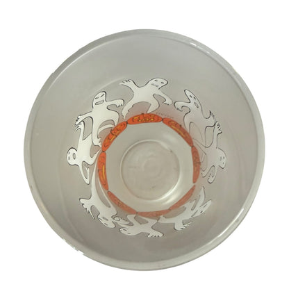 Clear glass glass tumbler interior with decorative design on a white background