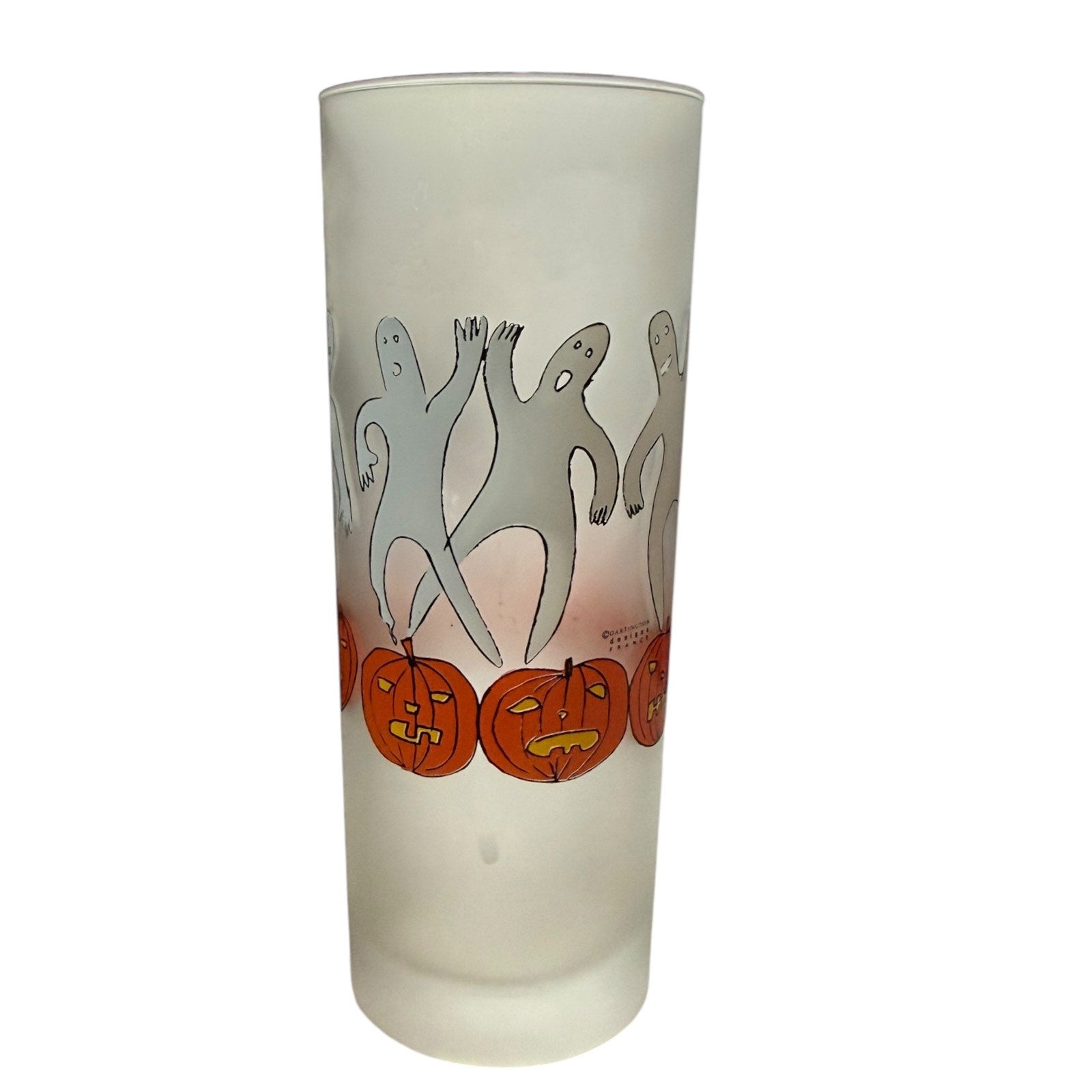 Frosted glass with Halloween designs of ghosts and pumpkins on a white background