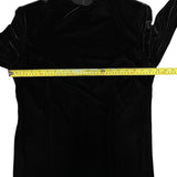 Pit to pit of black dress