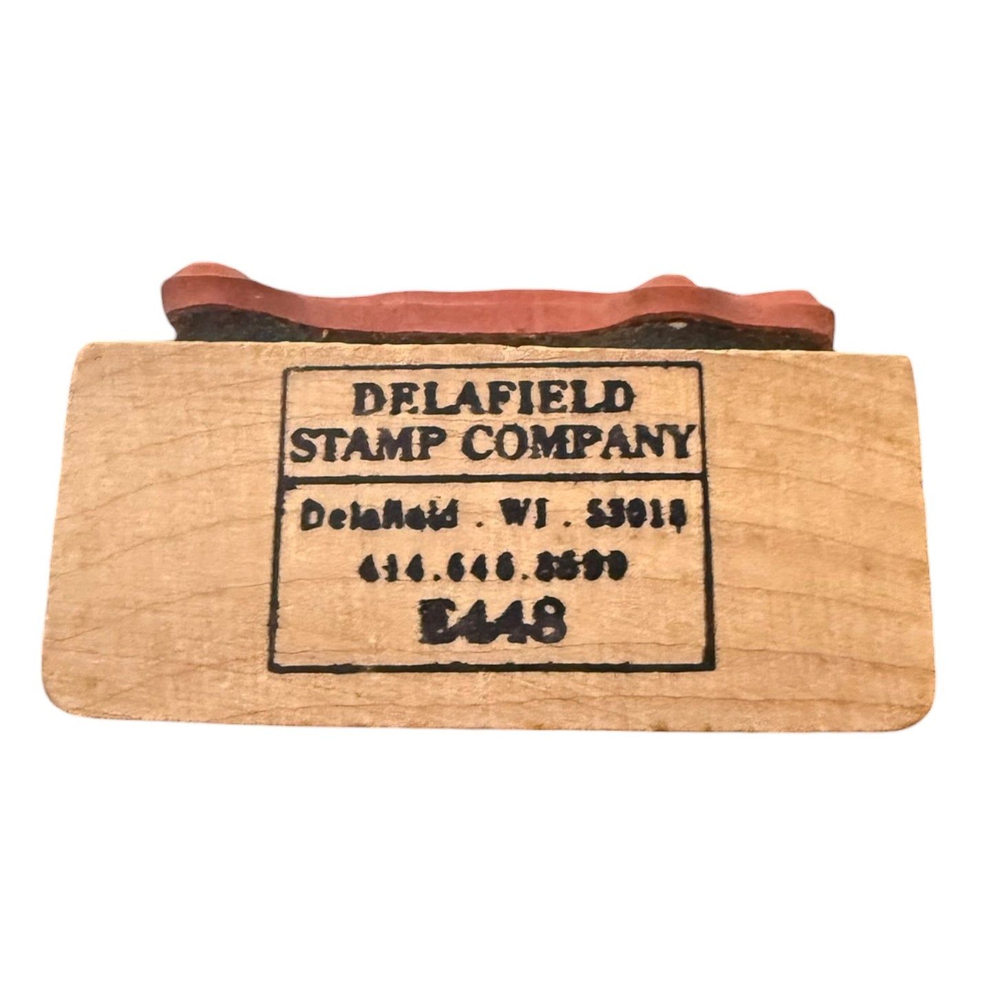 Side view of Delafield Stamp Company rubber stamps model number E448