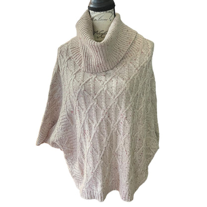 Knitted pink sweater on a mannequin against a white background