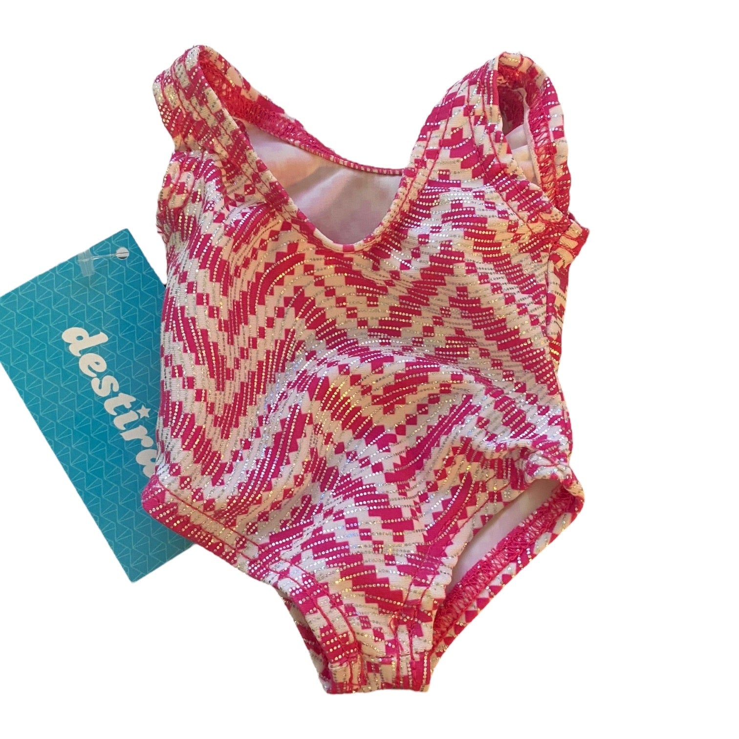 Colorful zigzag patterned leotard on a white background with a turquoise card below.
