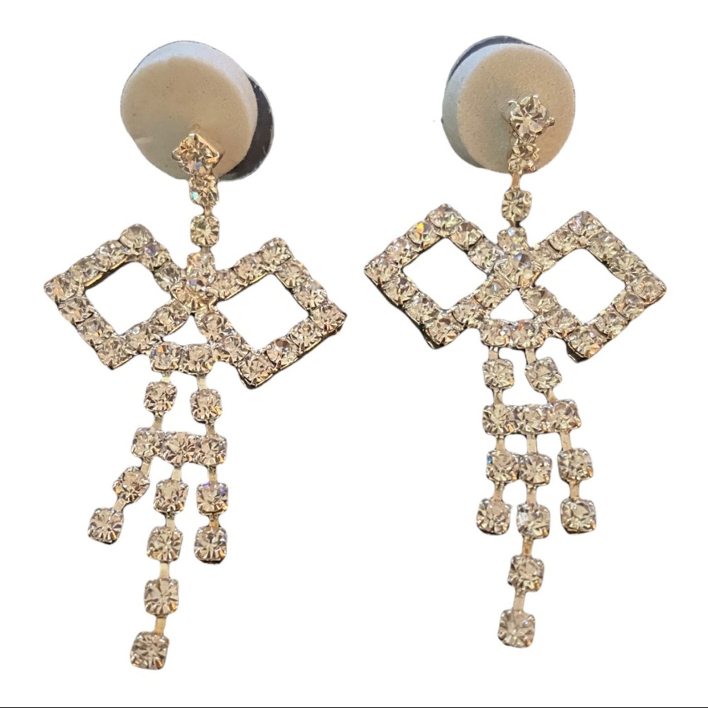 Pair of silver chandelier earrings on a white background